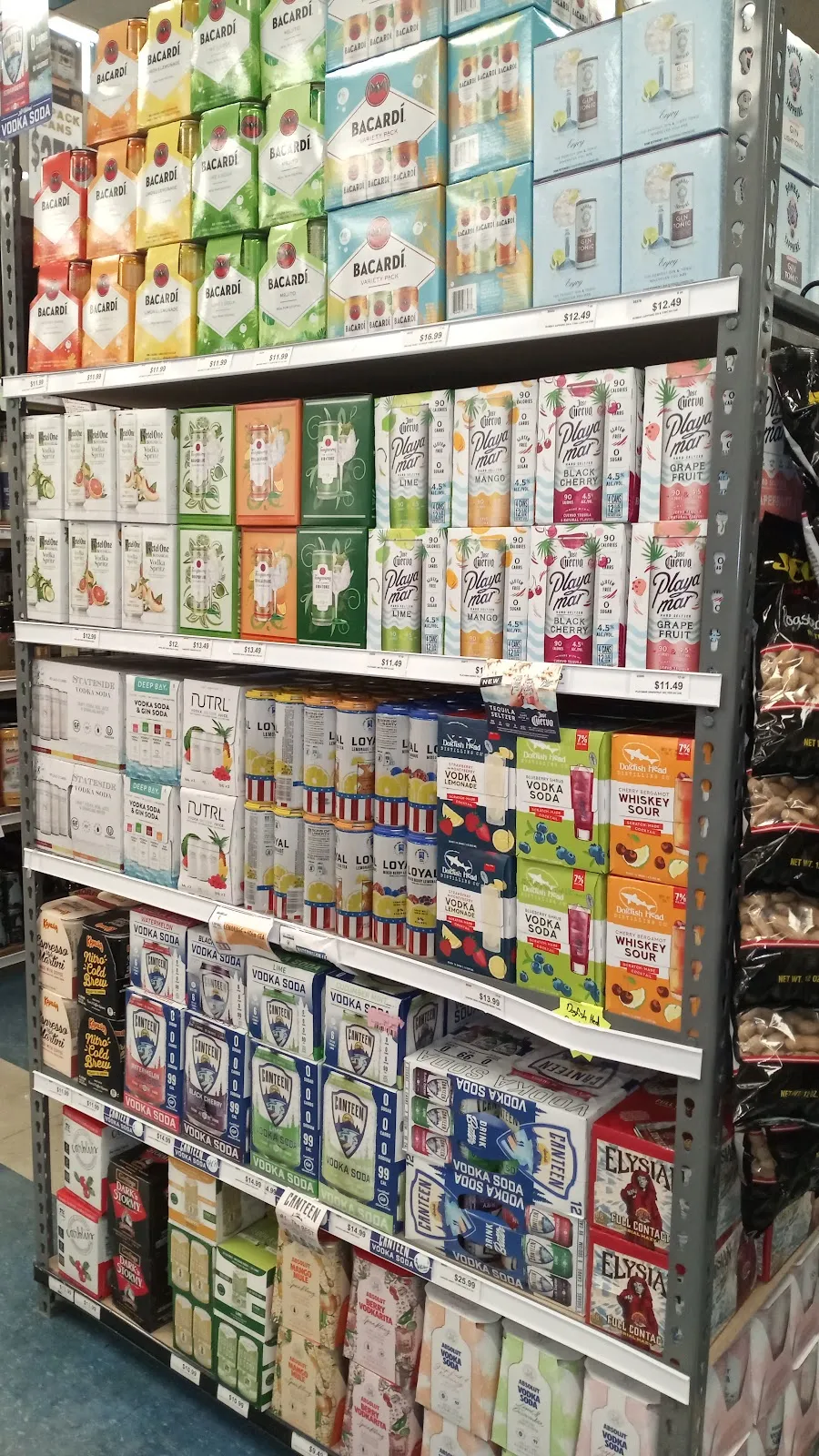 Cases of canned cocktails on shelves at Circle Liquor Store