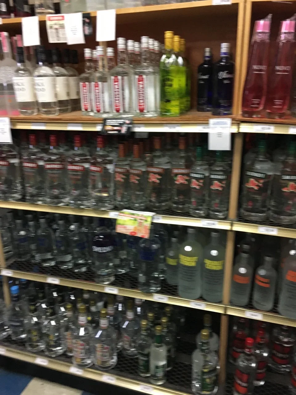 Vodka and gin bottles on the shelves at Circle Liquor Store